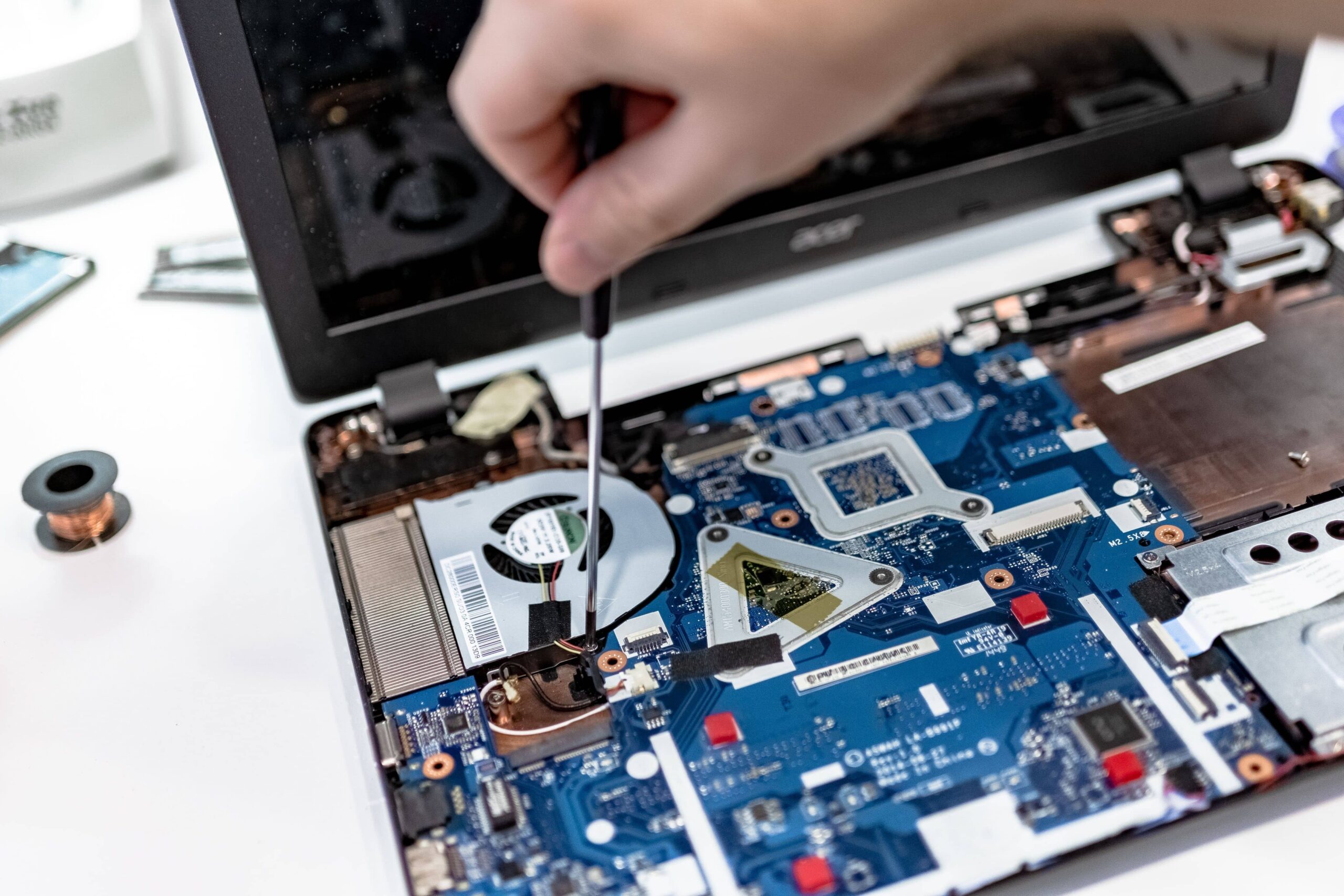 Laptop that has been taken apart and is in the middle of troubleshooting.